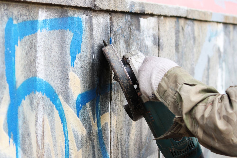 Removing Graffiti On Concrete Wall