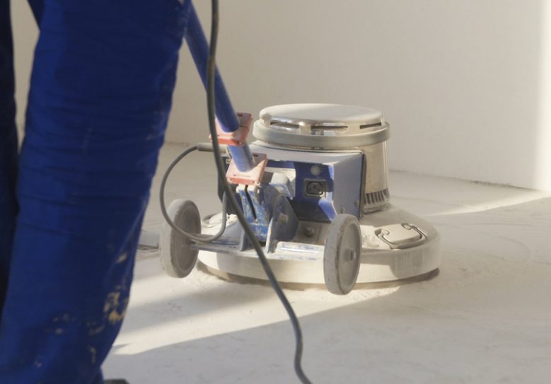 Man Polishing Marble Floor In Modern Office Building — Hire Pro In Mudgeeraba, QLD