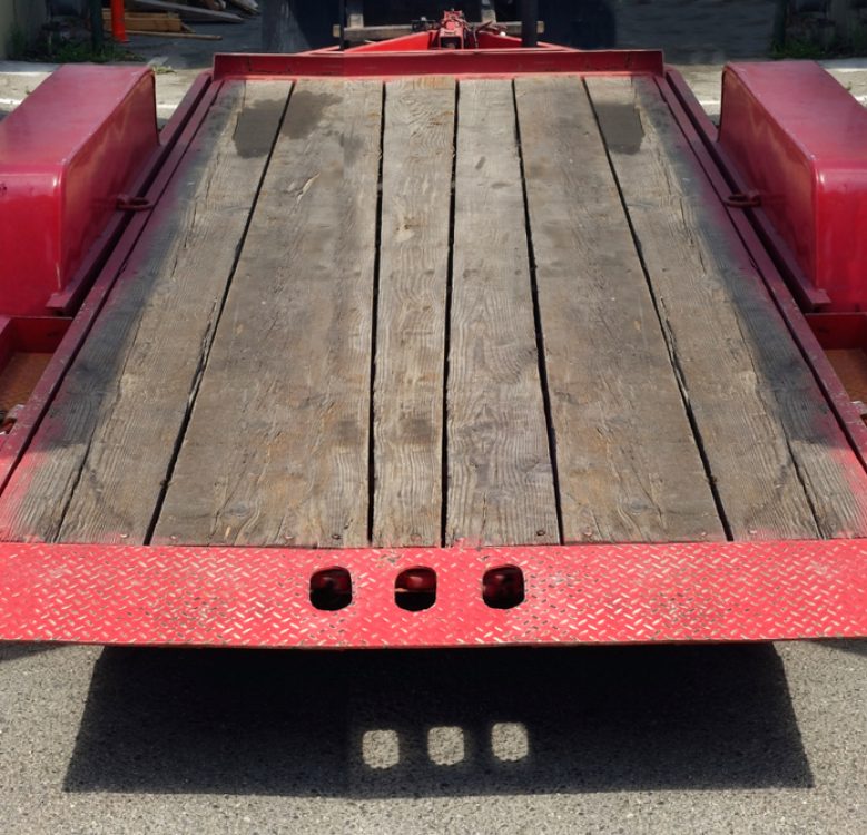 Well-Used Empty Red Flatbed Trailer — Hire Pro In Mudgeeraba, QLD