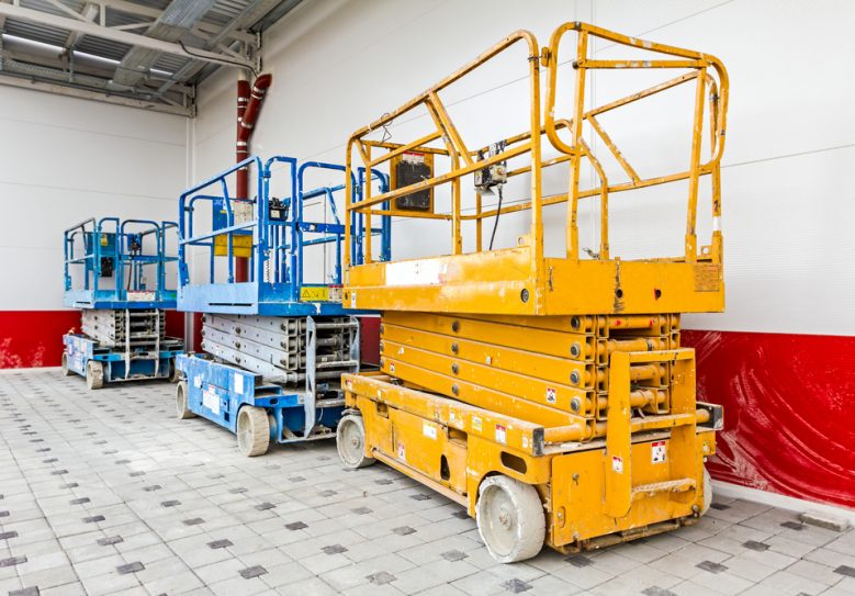 Scissor Lift Platform Parked On Construction Site — Hire Pro In Mudgeeraba, QLD