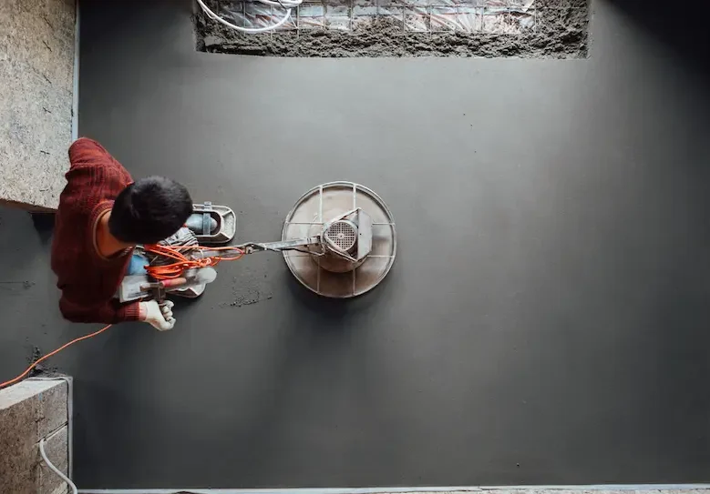 Worker Polishing Slab Floor — Hire Pro Mudgeeraba