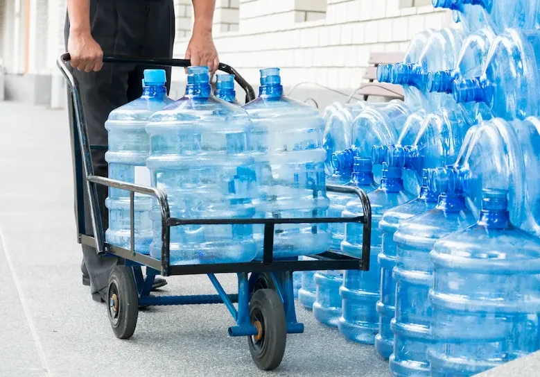 Water Gallon Delivery Using Trolley — Hire Pro In Mudgeeraba, QLD