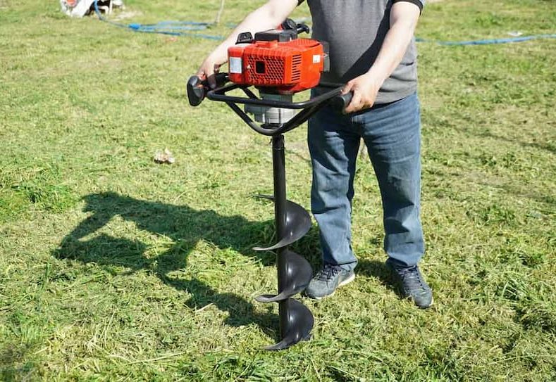 Soil Earth Auger Machine Drilling Into Ground — Hire Pro In Mudgeeraba, QLD