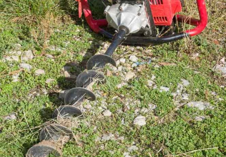 Earth Auger On Green Grass Drilling Into Turf — Hire Pro In Mudgeeraba, QLD