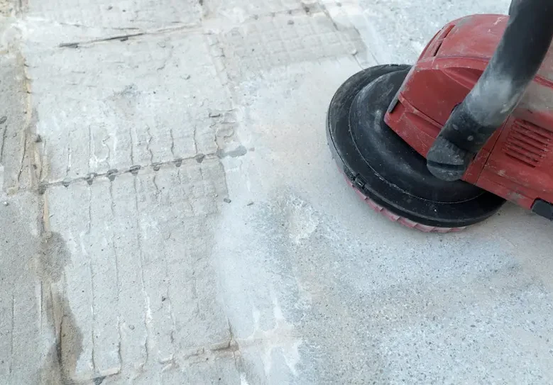 Worker Uses A Concrete Grinder — Hire Pro Mudgeeraba